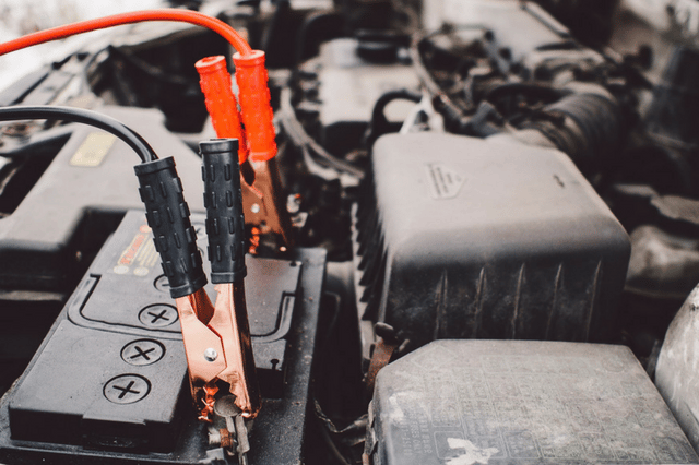Jumper cables on a car battery Jumper cables on a car battery