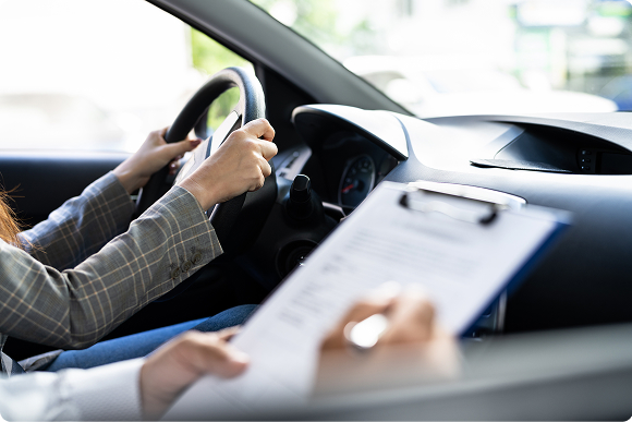 driving-school-instructor-observing-student-driver