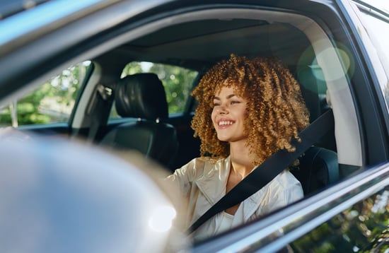 happy-young-woman-driving-SUV