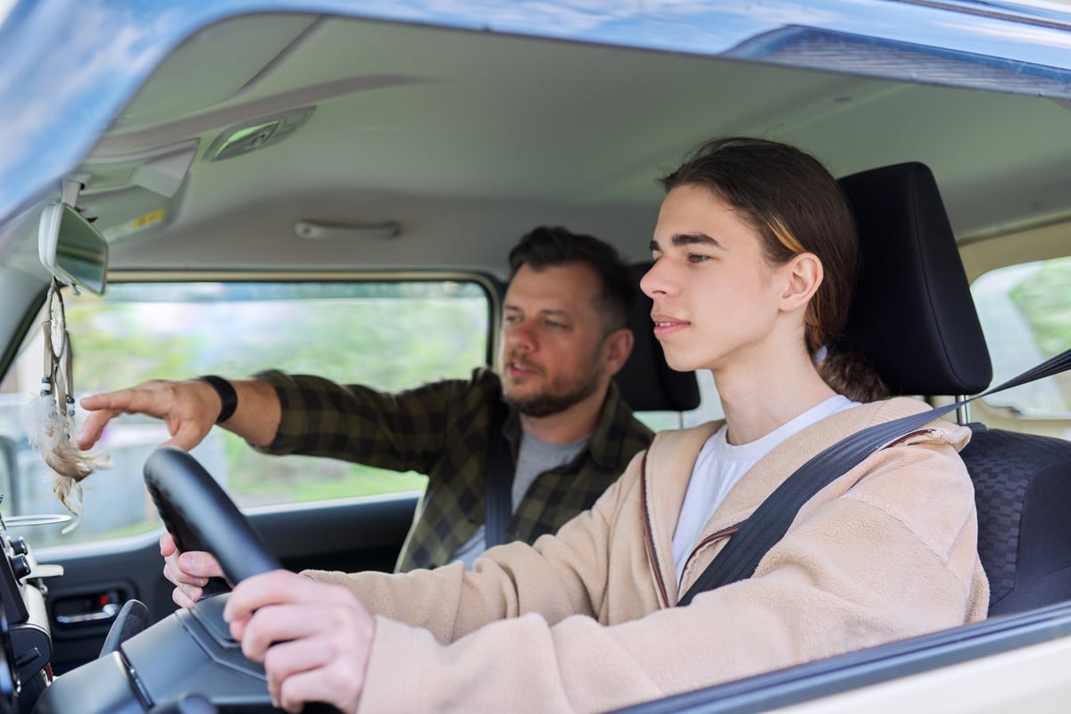 male-student-with-driving-instructor
